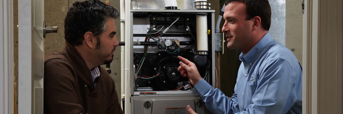 Hvac Dealer Talking To Homeowner About New Furnace