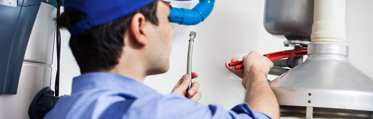 Plumber Repairing Water Heater